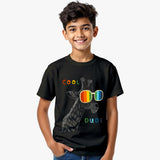 black kids t-shirt with funky giraffe wearing rainbow sunglasses and “Cool Dude” text with model