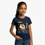 Young girl wearing a navy blue supima cotton t-shirt with a colorful pirate design on a white background
