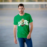 Man wearing a poly cotton green t-shirt with a graphic design and text, standing on a concrete surface.