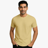 Man wearing a beige Supima cotton t-shirt in india on a white background