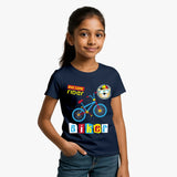Child wearing a navy blue supima cotton t-shirt with a colorful graphic and text on Awesome Rider