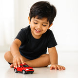 Child playing with a car wearing Suvin Gold Cotton black t-shirt