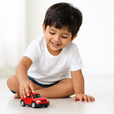 Child playing with a red toy car wearing Suvin Gold Cotton pure white t-shirt