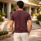 Man wearing a maroon suvin gold cotton t-shirt for men in india