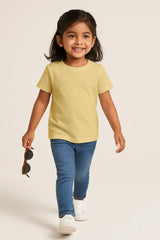 Child wearing a Supima Cotton  yellow t-shirt and blue jeans, 