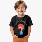 black cotton kids T-shirt for boys with giraffe in hot-air-balloon graphic and “Let’s Travel” text with model