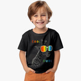 black kids t-shirt with funky giraffe wearing rainbow sunglasses and “Cool Dude” text with model
