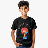 black cotton kids T-shirt for boys with giraffe in hot-air-balloon graphic and “Let’s Travel” text with model