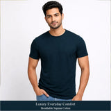 Man wearing a Supima lisle dark navy blue t-shirt with text about luxury everyday comfort and breathable supima cotton.
