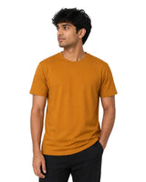Male model wearing a rustic orange Supima cotton T-shirt with a minimalist crew neck design.