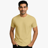 Man wearing a beige Supima cotton t-shirt in india on a white background