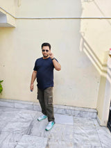 Man in Noobrand Supima Cotton navy t-shirt and cargo pants 