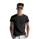 Model wearing a black Supima cotton t-shirt for men, showcasing style and comfort.

