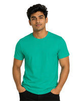 Male model wearing a teal green Supima cotton T-shirt with a minimalist crew neck design.