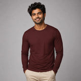 Man wearing burgundy full sleeve Suvin Gold cotton t-shirt front view showing rich colour and premium ELS cotton fit