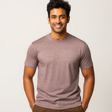 Man wearing a mauve Hiking and cycleing  t-shirt against a plain background