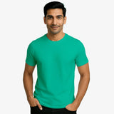 Man wearing a teal supima cotton t-shirt