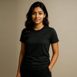 Woman wearing a suvin gold cotton black t-shirt against a beige background