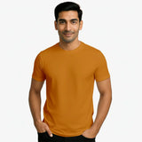 Man wearing a mustard yellow supima cotton t-shirt 