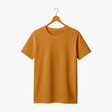 Mustard yellow supima cotton t-shirt on a hanger against a white background