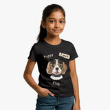 Young girl wearing a Supima Cotton black t-shirt with a dog graphic and text on a white background