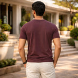 Man wearing a maroon suvin gold cotton  t-shirt for men in india 